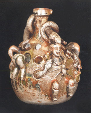 A rare Anna Pottery temperance jug with hellish forms of humans and serpents writhing in the applied decoration on the fanciful 10½-inch piece had been consigned by Southerner who said it had always been in the family. The circa 1875 bulbous, salt-glazed jug was won by a $35,650 left bid.