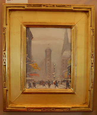 A snowy cityscape with an American flag appeared to be a Twentieth Century scene and realized $3,600. 