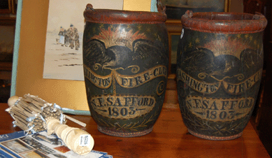 The 1803 pair of Salem leather fire buckets belonging to a member of the Washington Fire Club sold for $19,200. The Nineteenth Century sailor made ivory swift brought $2,880.