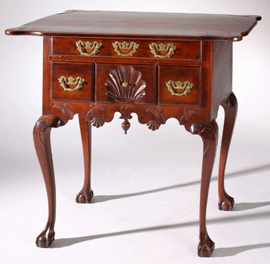 A Connecticut cherry dressing table, circa 1770‱790, would have been purchased with a high chest in a bedroom suite. It would likely have been used to store cosmetics, which were essential in a time when men and women both wore heavy makeup to even out their complexions. According to the records of antiquarian and dealer John Kenneth Byard, the item was a betrothal piece for Captain Augustus Henry Griswold of Old Lyme, Conn. 