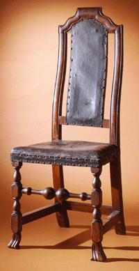 Even Puritan Bostonians were not adverse to comfort. The Boston maple "crook'd back chair,†circa 1700, with the original Russian leather seat was designed to fit the lower spine †a technique adapted from Chinese examples. Such chairs, inexpensive versions of William and Mary cane back chairs with carved crests, were made in Boston and shipped up and down the Atlantic seaboard.