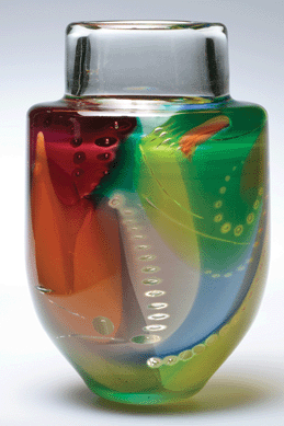 Tom McGlauchlin, who participated in the first Toledo Workshop, built on European techniques and works by Washington Color School painters like Gene Davis and Morris Louis in creating "'Dessin de Bulle' Vase,†1978. It incorporates McGlauchlin's observation that when glass was blown, "color would get stretched and become thinner&⁛looking] like acrylic paint that's been poured over a canvas, which is what&⁌ouis†did. Toledo Museum of Art. 
