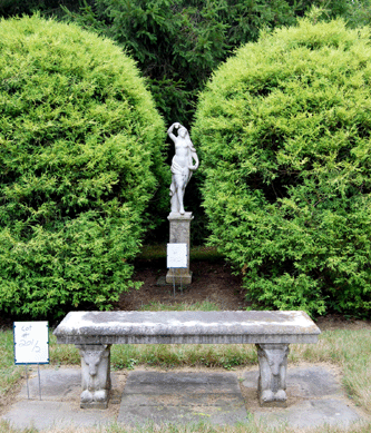 A pair of Classical marbles brought $7,015 and a pair of marble benches with ram's head bases was $6,440. One of each is shown and both pair were sold in place.