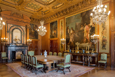 This view of the dining room shows how the room was designed around the paintings.