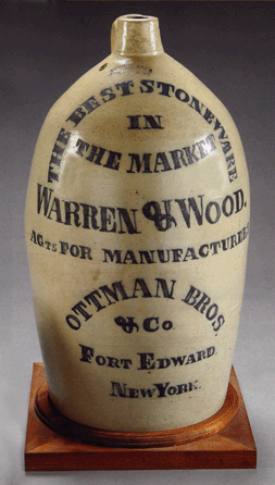 A monumental presentation American stoneware advertising masterpiece, 32 inches high and 56 inches in circumference, sold within estimate at $103,500. The jug was created to be presented to the top sales dealer at the time Warren & Wood. 