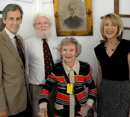 Miriam McCue seemed pleased to be watching the prize possessions that she and her husband collected for more than 60 years being passed along to other Shaker enthusiasts. She is flanked by her son Brian, and auctioneers Willis and Karel Henry. 