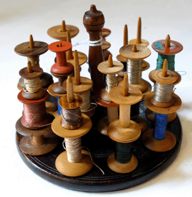The rare Canterbury spool holder and 30 spools was hotly contested; it realized $29,250.