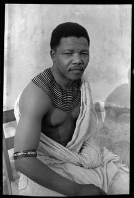 Eli Weinberg, Nelson Mandela portrait wearing traditional beads and a bedspread. Hiding out from the police during his period as the "black pimpernel,†1961. Courtesy of IDAFSA.