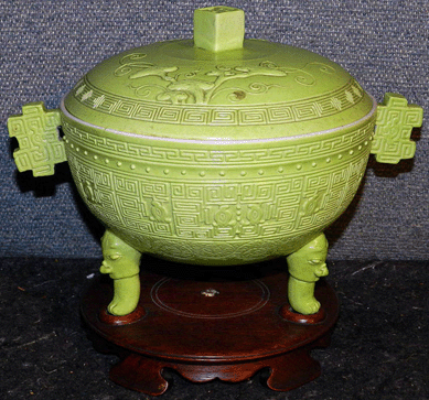 A Japanese 2-handled bowl with lid on custom stand went to $17,250.