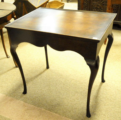 A tray-top tea table with elegant shaped skirt made by Samuel Sewell, York, Maine, went out at $4,485.