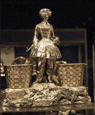 J.H. Bourdon-Smith Ltd, London, offered an unusual Victorian figural salt in the form of a vivandiere, made in 1866, London, by C.F. Hancock.