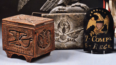 Three popular objects in the sale included, from left, a patriotic relief-carved "Fort Hancock†wooden box, possibly New Jersey, late Nineteenth or early Twentieth Century, hinged lid and shaped feet, the side decorated with eagles, stars, flags and foliage, that sold for $1,080 against a high estimate of $1,200. The provenance lists Oakland Antiques. The eagle-carved soapstone bedwarmer, early Nineteenth Century, with relief carved eagle, shield and furled flags, wire handle, 7½ by 10 inches, had a high estimate of $600 and sold for $2,640. At right, the painted tin militia hat plate, Connecticut, circa 1825, decorated with gilt spreadwing eagle with shield, 9¼ inches high and 6¼ inches wide, sold for $5,100, against a high estimate of $800. The provenance lists Bill Guthman.