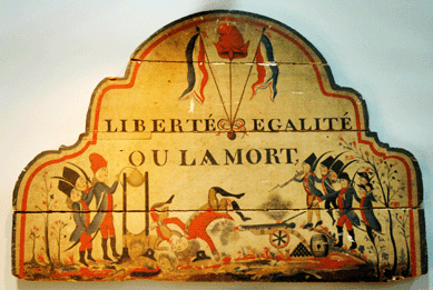 Getting much interest in the booth of Little Acorns Antiques, Morristown, N.J., was this folk art wood panel from the French Revolution depicting scenes of battle and guillotines with the motto "Liberté, Egalité ou La Mort.†