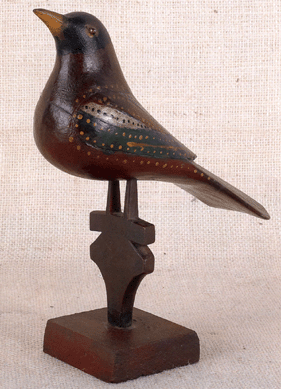 Carved and painted bird on perch by Virginville Carver (Pennsylvania, late Nineteenth⁥arly Twentieth Century), 9¼ inches high, estimated at $10/15,000. It sold for $35,550 to a phone bidder and the provenance lists Richard and Rosemarie Machmer.