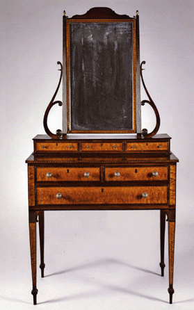 A bid of $312,000, well over the $200,000 high estimate, took this Federal carved mahogany and bird's-eye maple veneer dressing chest with mirror, attributed to Thomas Seymour, probably with John Seymour, Boston, circa 1805‱810, original brasses, 73½ inches high, 35 inches wide. The provenance lists the estate of Virginia Couper Johnson of New York City.
