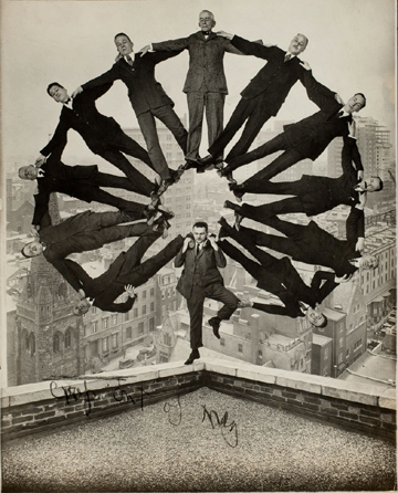 Unidentified American artist, "Man on Rooftop with Eleven Men in Formation on His Shoulders,†circa 1930, gelatin silver print. Collection of George Eastman House, International Museum of Photography and Film, Rochester, N.Y..
