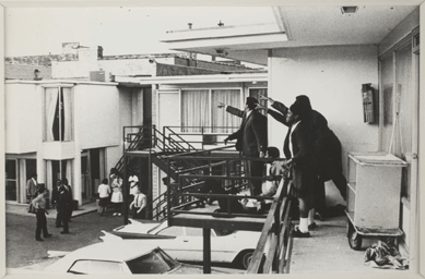 South African television producer Joseph Louw, preparing a documentary about the American Civil Rights movement, was staying at the Lorraine Hotel in Memphis on April 4, 1968. After hearing gunfire, he rushed with his camera to a balcony, where he photographed the moment when the Reverend Martin Luther King collapsed from his wounds and startled aides pointed toward the source of the shot.