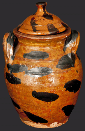 The top lot of the auction was this covered redware jar from the Cain Pottery, Sullivan County, Tenn., that sold for $23,000.