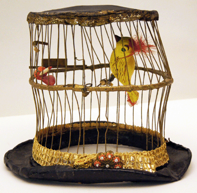 Clown Felix Adler joined the circus at 13. An Iowa farm boy, he wore his birdcage hat, circa 1940‱950, in his acts that involved piglets. Circus World Museum.