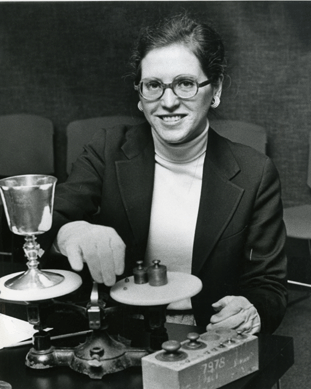 Patricia Kane examines silver by John Hull and Robert Sanderson at the First Parish Church, Quincy, Mass., 1978. The curator wrote her doctoral dissertation on the craftsmen, whom she regards as America's first major silversmiths. 