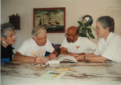 The collectors Ethel and Martin Wunsch and E.J. Nusrala peruse the 1994 edition of Chipstone Foundation's journal American Furniture with Patricia Kane, right. Kane is the first recipient of the Wunsch Americana Foundation's merit award for outstanding contribution to the American arts.