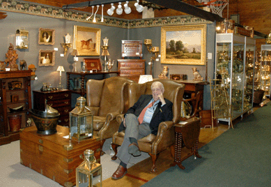 Zane Moss can personally attest to the comfort provided by a pair of large English leather chairs with ball and claw feet and brass nail heads that were featured in the New York City dealer's booth.