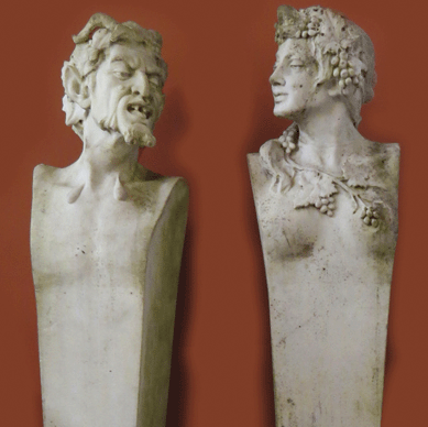 The Nineteenth Century Italian white marble set of Bacchanalian garden herms, one a satyr and the other a maiden adorned with grapes, brought $19,890.
