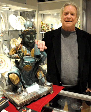 Peter Rosenberg, Vallin Galleries, Wilton, Conn., with a rare Chinese three-colored sancai stoneware sculpture of Gaundi (the God of War) from the Ming dynasty.