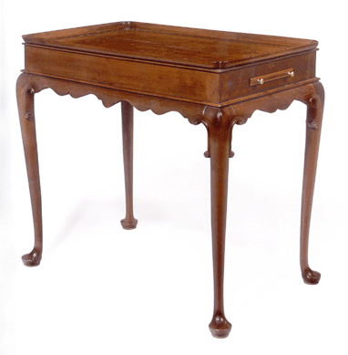 Characterized as a masterpiece by Albert Sack in his book The New Fine Points of Furniture, 1993, this circa 1740‶0 Boston Queen Anne carved mahogany tea table, with a pinched corner top, carved C-scrolls and a candle slide made $552,500 at Christie's 1995 auction of the collection of Mr and Mrs Eddy Nicholson. Its value nearly doubled in 18 years, bringing $962,500 from Yardley, Penn., dealer Todd Prickett.