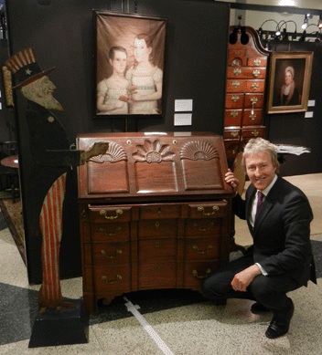 Leigh Keno with the Chippendale slant front desk and the cast iron figure of Uncle Sam.