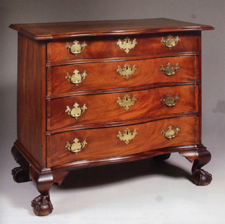 This serpentine chest of drawers, offered from a private American collection, is of Massachusetts origin, circa 1760‱780, and measures 32¾ inches high, 34 inches wide and 20¾ inches deep. It is of richly figured crotch mahogany and has boldly carved ball and claw feet and spur returns. Bidding opened at $40,000, and the final bid, with premium, was $117,800, to a phone bidder. The high estimate was $80,000.