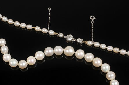 This Tiffany & Co. single strand of graduated natural pearls with 18K gold and diamond clasp was the top lot, selling at $143,750.