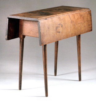 Shaker experts John Keith Russell and Doug Hamel agreed that the price of this birch and cherry Shaker drop leaf table, probably from Hancock Village in New York, could have gone higher had the table not been warped. As it was, the piece, which opens to 32 inches wide, soared to $66,700 against its $3/5,000 estimate, selling to a phone bidder against underbidder Albert Sack.