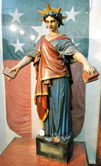 The large wood carving of Lady Liberty in the original painted surface sold well above estimates at $40,250