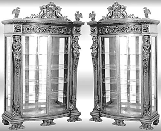 A pair of R.J. Horner oak china cabinets was carved with maidens, lions and griffins and sold for $14,950.