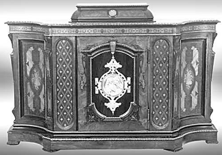 The massive rococo rosewood credenza had marquetry inlay, bronze mounts, a bronze center plaque with an image of a mother and child, and with inlaid musical instruments on the side doors. It fetched $8,050.