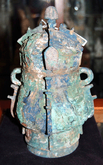 The ancient bronze vase was from the Shahn period (1600‱100 BC) and remained colorful with malachite and cuprite and Tao Tieh masks. It sold for $29,375.