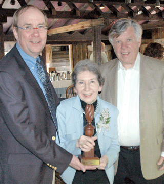 John Keith Russell, president of ADA, presenting the Award of Merit to Satenig "Sat†St.Marie. At right is Lincoln Sander who has taken over the duties of executive director for the organization. ⁒. Scudder Smith photos