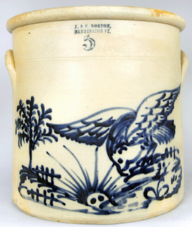 A J.&E. Norton, Bennington, Vt., five-gallon stoneware crock decorated with a hawk and a rising sun brought $22,425.