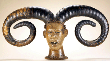 This elaborate, skin-covered crest mask was worn on top of the head by early Twentieth Century Nigerians, possibly the Efik peoples from the lower Cross River region, with a costume covering the body of the masked performer. The hairstyle is an exaggerated version of one worn by young women during coming-of-age rituals. 