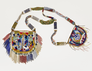 Designed to be used by a Nigerian Yoruba diviner to carry ritual objects, this bag is festooned with brilliantly colored beads and a fringe symbolizing deities. Only kings and those communicating with the gods were allowed to own such fully beaded objects.