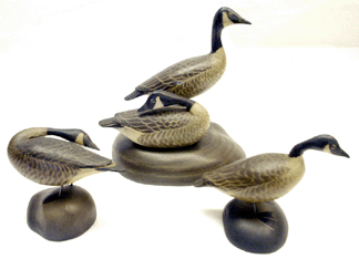 A group of oversized miniature Canada geese by Crowell did quite well. The goose in preening form, left, sold for $20,700, the pair of Canada geese on a clamshell base brought $26,450, and $5,175 was paid for the single.