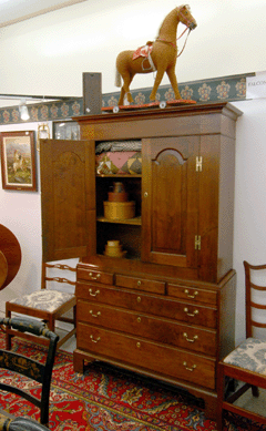 Falcon's Roost, Grantham, N.H., sold this circa 1860 Pennsylvania walnut linen press, one of several pieces of beautiful American furniture on offer.