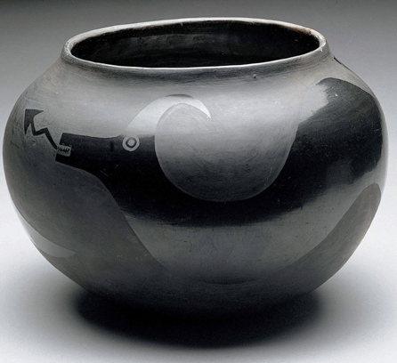 With museum director Edgar L. Hewitt's encouragement, Maria and Julian Martinez formulated a new style of San Ildefonso pottery featuring matte black and polished black surfaces. This "Jar with Avanyu,†circa 1919‱920, incorporating a feathered serpent representing water, was applauded by Anglo Modernists.