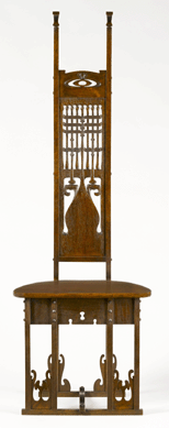 An intricately carved hall chair, similar to one made as part of the "Graceful Writing Set†by Charles Rohlfs, circa 1904, oak, 57 by 18 7/8 by 17 inches. Milwaukee Art Museum, gift of American Decorative Art 1900 Foundation in honor of Glenn Adamson. 