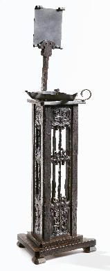The Charles Rohlfs carved candlestand, 1902, is constructed of oak and copper, 26½ by 10 3/8 inches. Carnegie Museum of Art, promised gift of American Decorative Art 1900 Foundation in honor of Joseph Cunningham. 