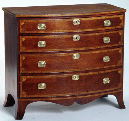 This bowfront chest with four fan-inlaid drawers and high French feet was made by Alden Spooner, Athol, and was signed and dated on the underside in July 1807.