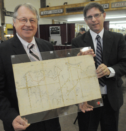 "This is the most important map in American history,†remarked Jim Julia, left, as he offered George Washington's personal copy of a map of the Battle of Yorktown. Julia's Americana expert Bill Gage was equally enthused, especially when it hammered down at $1 million, $1,150,000 with premium.