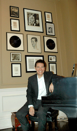 A piano fills a corner in Michael Feinstein's New York City home, with a wall of Gershwin memorabilia in the background. ⁒. Scudder Smith photo