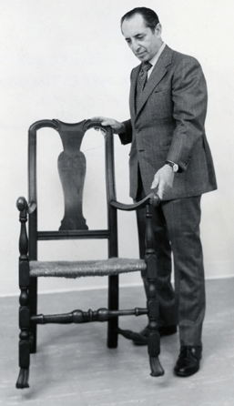 Albert Sack with a transitional Queen Anne armchair, in a photograph taken in the 1970s to promote a lecture.